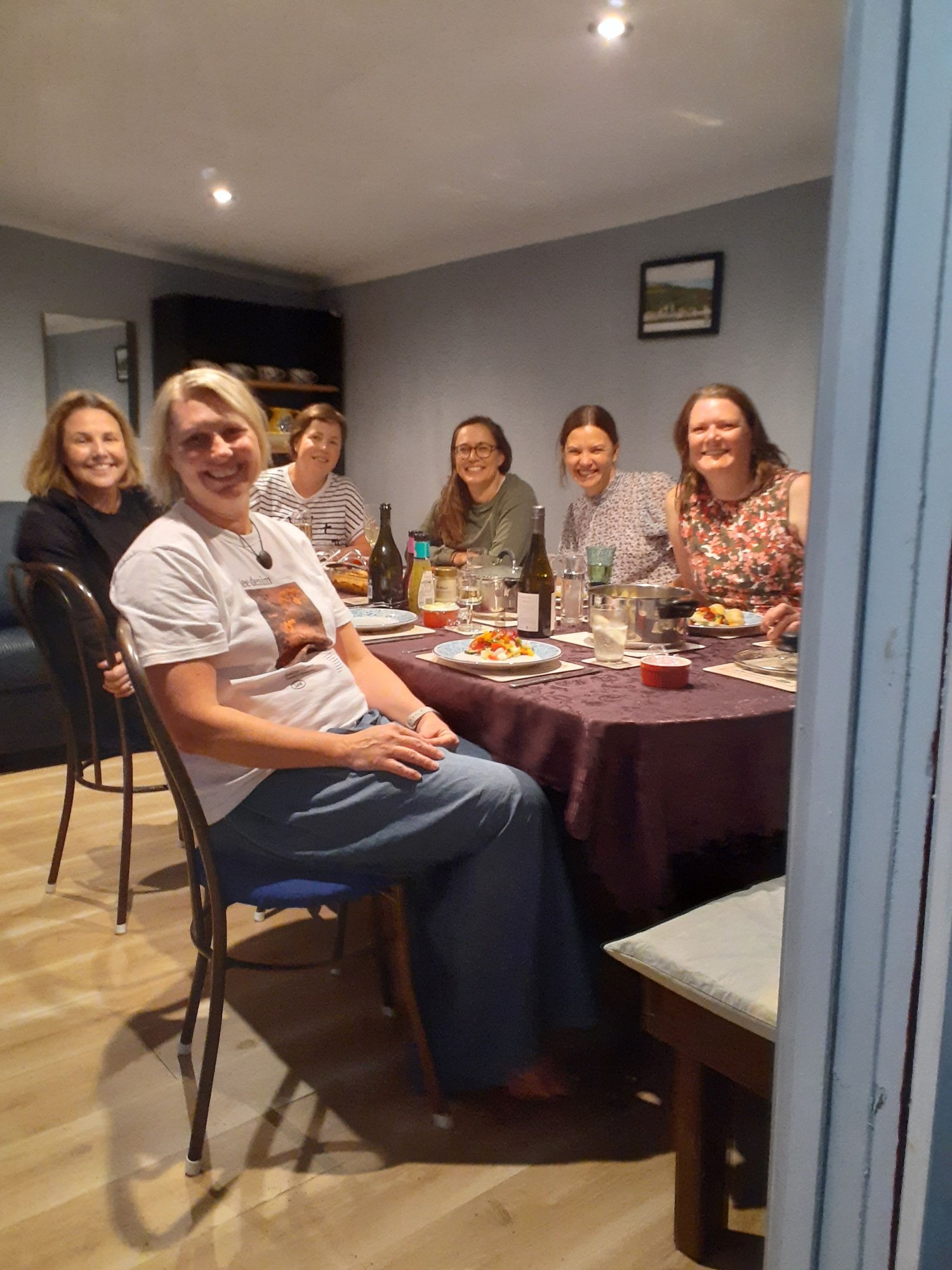 Whareama guests sharing their first-night dinner before the walk